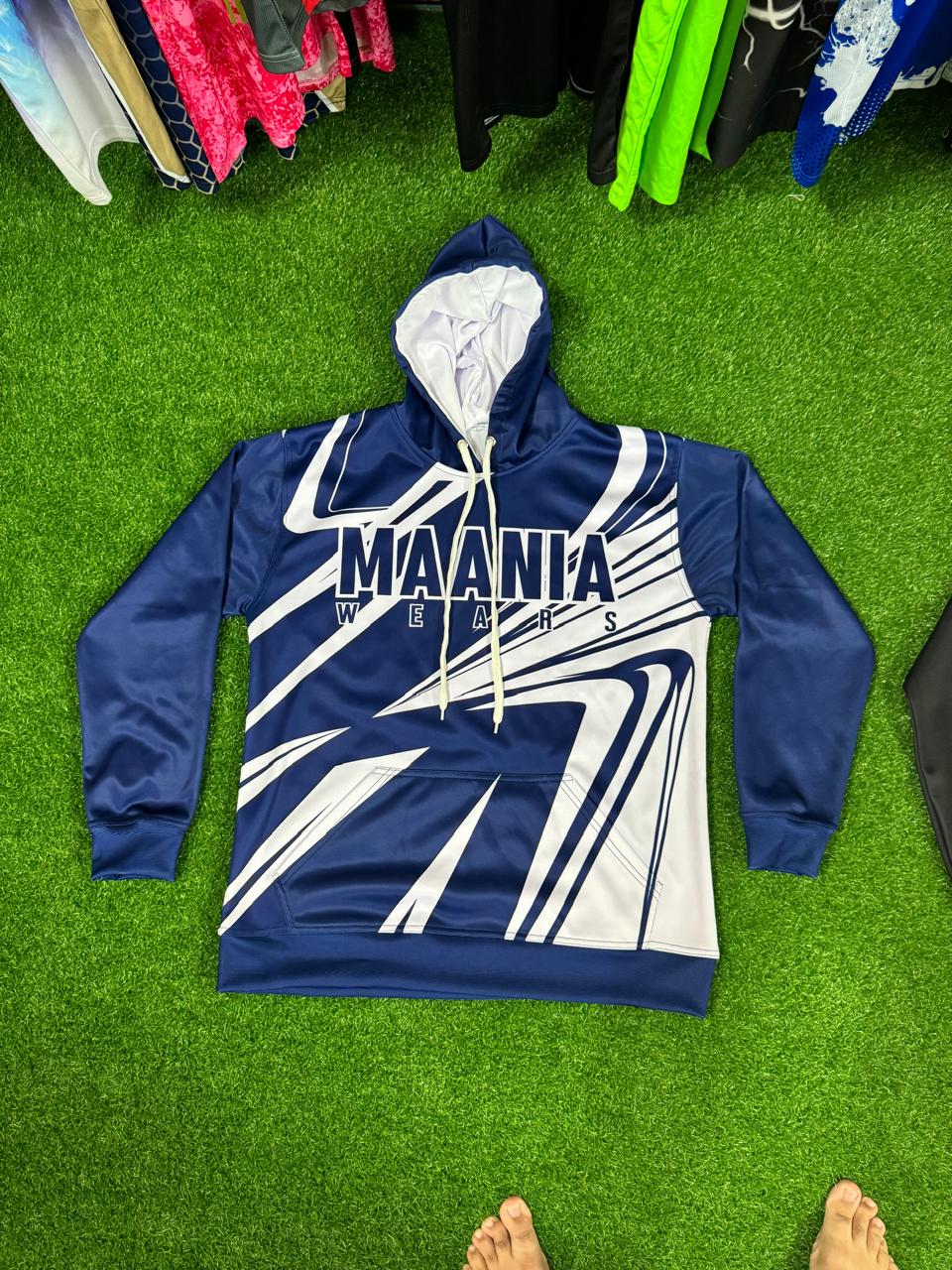 Maania Wears men's navy blue pullover hoodie with sharp white abstract graphics and kangaroo pocket.